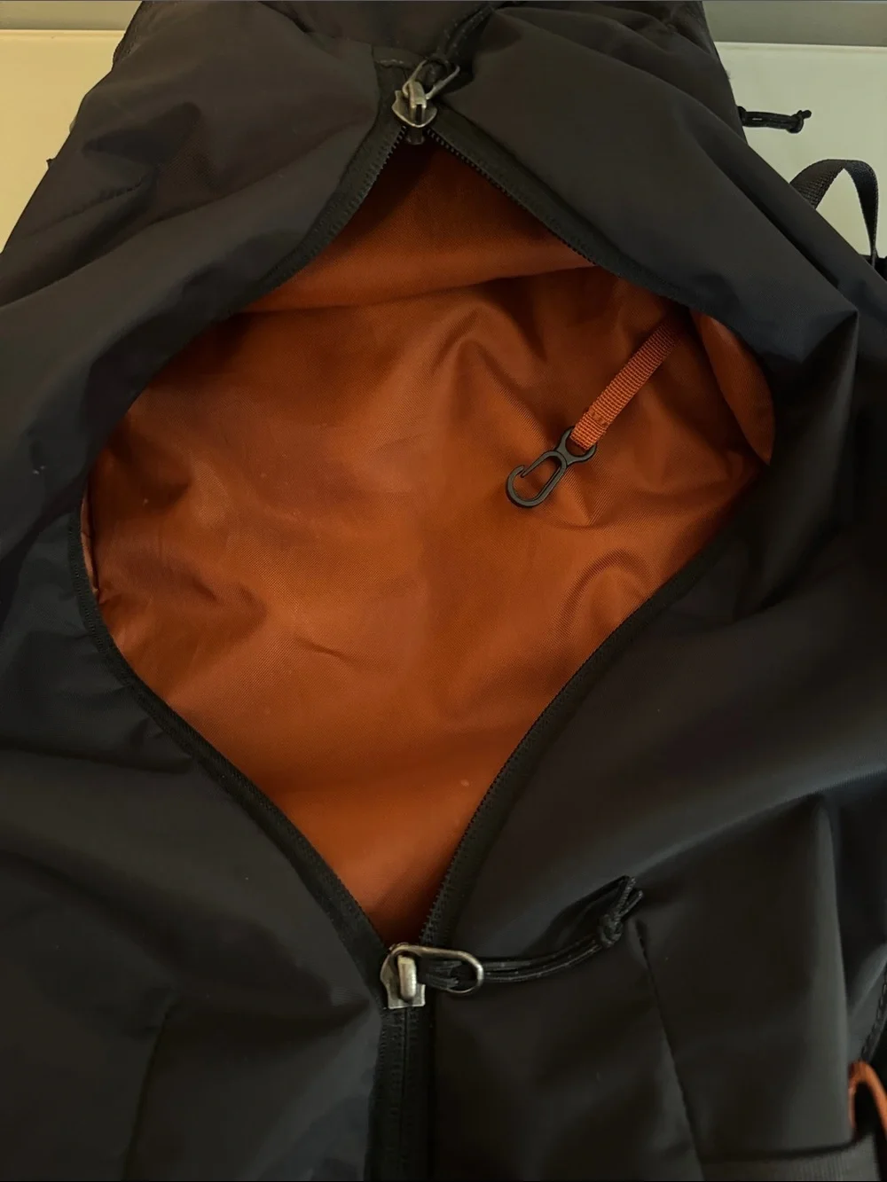 Patagonia Black Backpack with Orange Logo and Accents